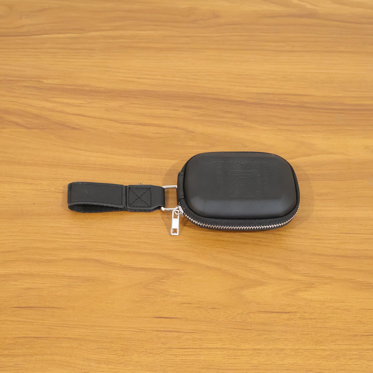 Wukusy premium hard shell earphone carrying case with zipper closure, compact and protective for storing earbuds or small accessories.