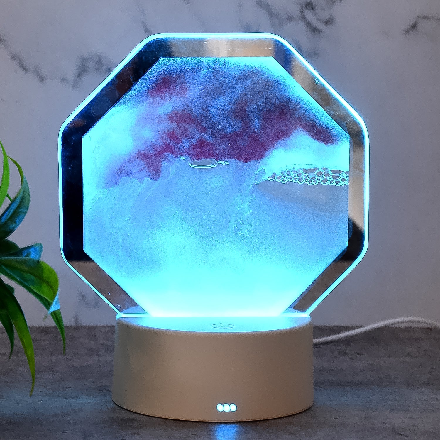 Wukusy LED Moving Sand Art Table Lamp for office, featuring flowing colorful sand patterns in a sleek glass vessel.