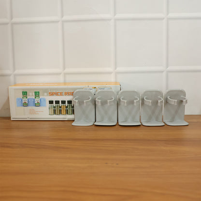 Wall-mounted Wukusy adjustable spice rack organizer with multiple shelves for kitchen storage and spice jars.