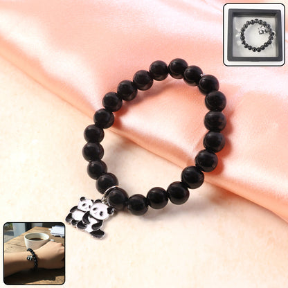 Black beaded stretch bracelet by Wukusy with a cute panda charm, featuring elastic design and stylish black beads.