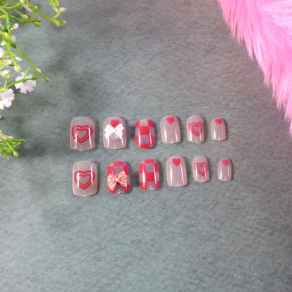 Set of Wukusy premium artificial false nails with mixed designs, showcasing various stylish nail art options.