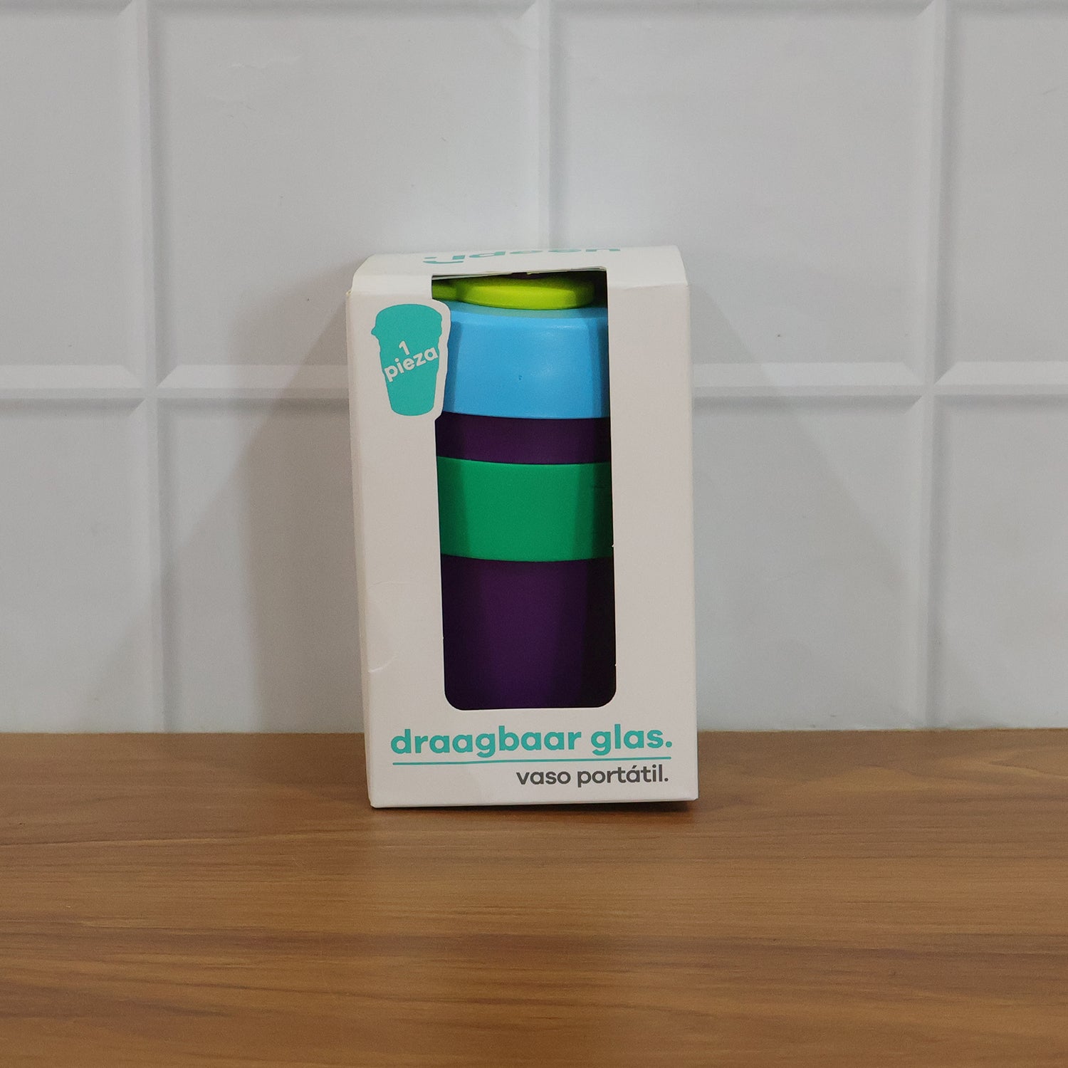 Colorful reusable travel mug with secure silicone lid, 400 ml capacity, by Wukusy, shown with vibrant design and leak-proof lid.