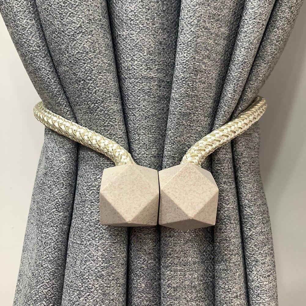 Pair of Wukusy 1441 hexagonal magnetic braided rope curtain ties with loop binding and buckles for home decor window curtains.