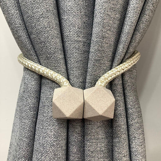 Pair of Wukusy 1441 hexagonal magnetic braided rope curtain ties with loop binding and buckles for home decor window curtains.