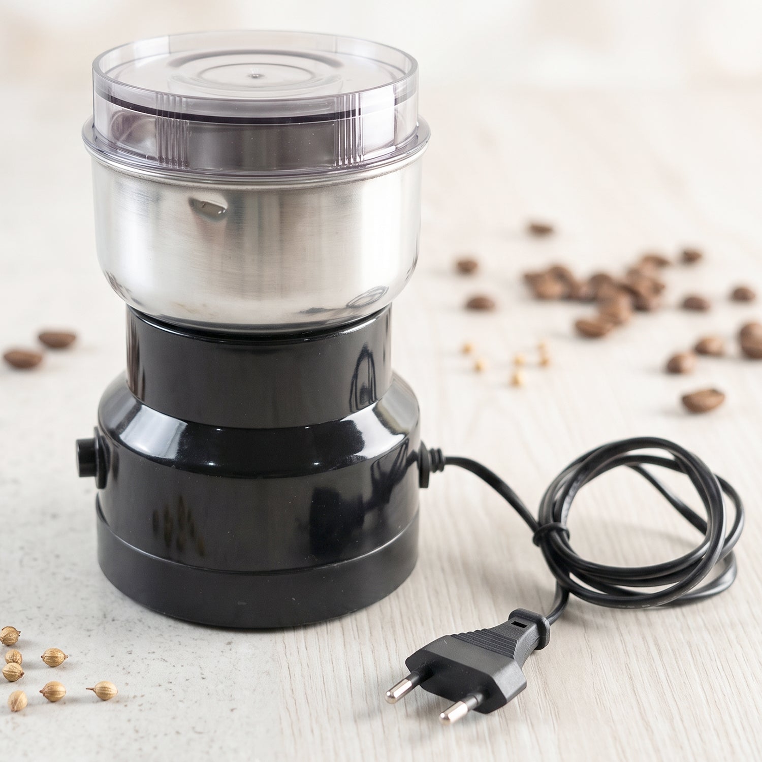 Wukusy electric coffee grinder with stainless steel blade for spices, compact kitchen appliance, black and silver design
