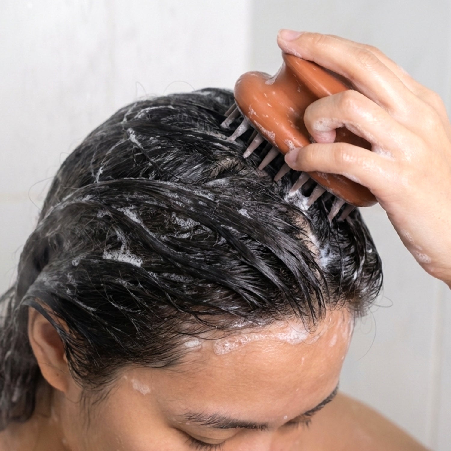 Wukusy manual scalp massage shampoo brush showing soft silicone bristles for gentle scalp cleansing and massage.