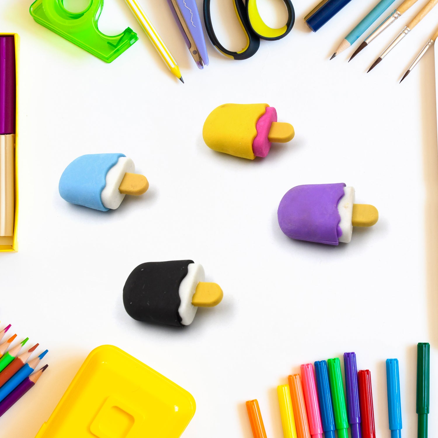 Set of four Wukusy ice cream-themed erasers and pencils with doughnut and lollipop shapes, ideal for kids' school supplies.