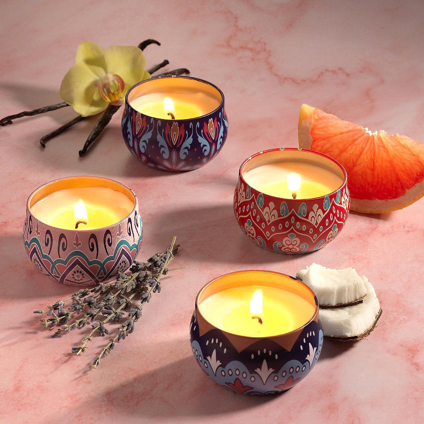 Set of four Wukusy decorative metal candle containers with colorful mandala prints, ideal for home decor or candles.