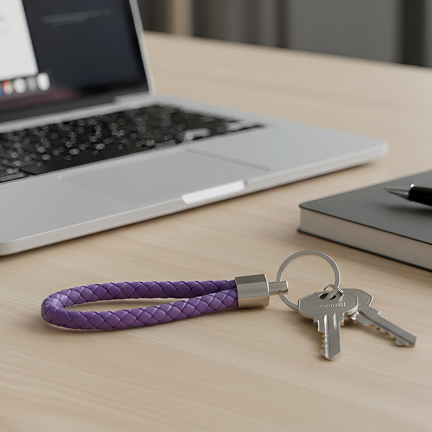 Set of four braided loop keychains by Wukusy featuring colorful woven designs on durable metal key rings.