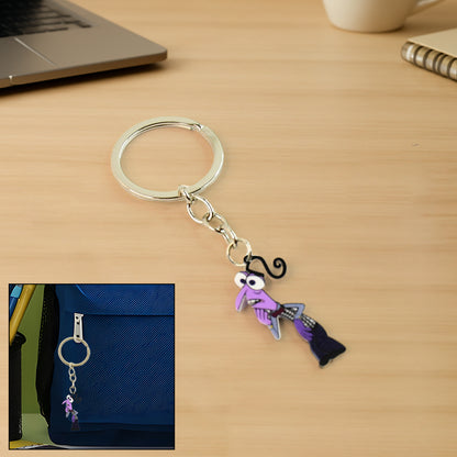 Wukusy cartoon character keychain used as home decor, featuring a colorful, playful design with a cartoon figure.