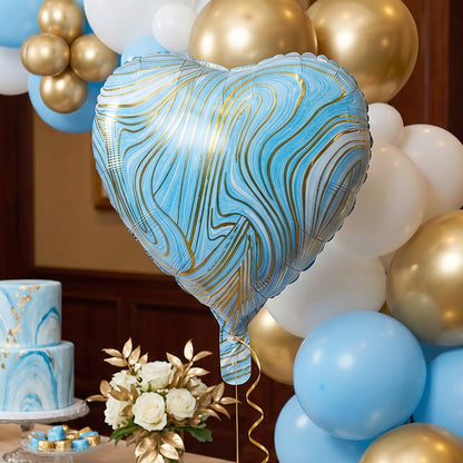 Blue marble heart foil party balloon from Wukusy, inflated and floating, with shiny metallic surface and vibrant marble pattern.