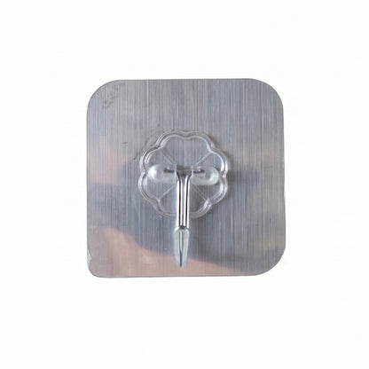 Transparent heavy-duty self-adhesive wall hook by Wukusy attached to wall, showing strong adhesive and versatile use for hanging items.