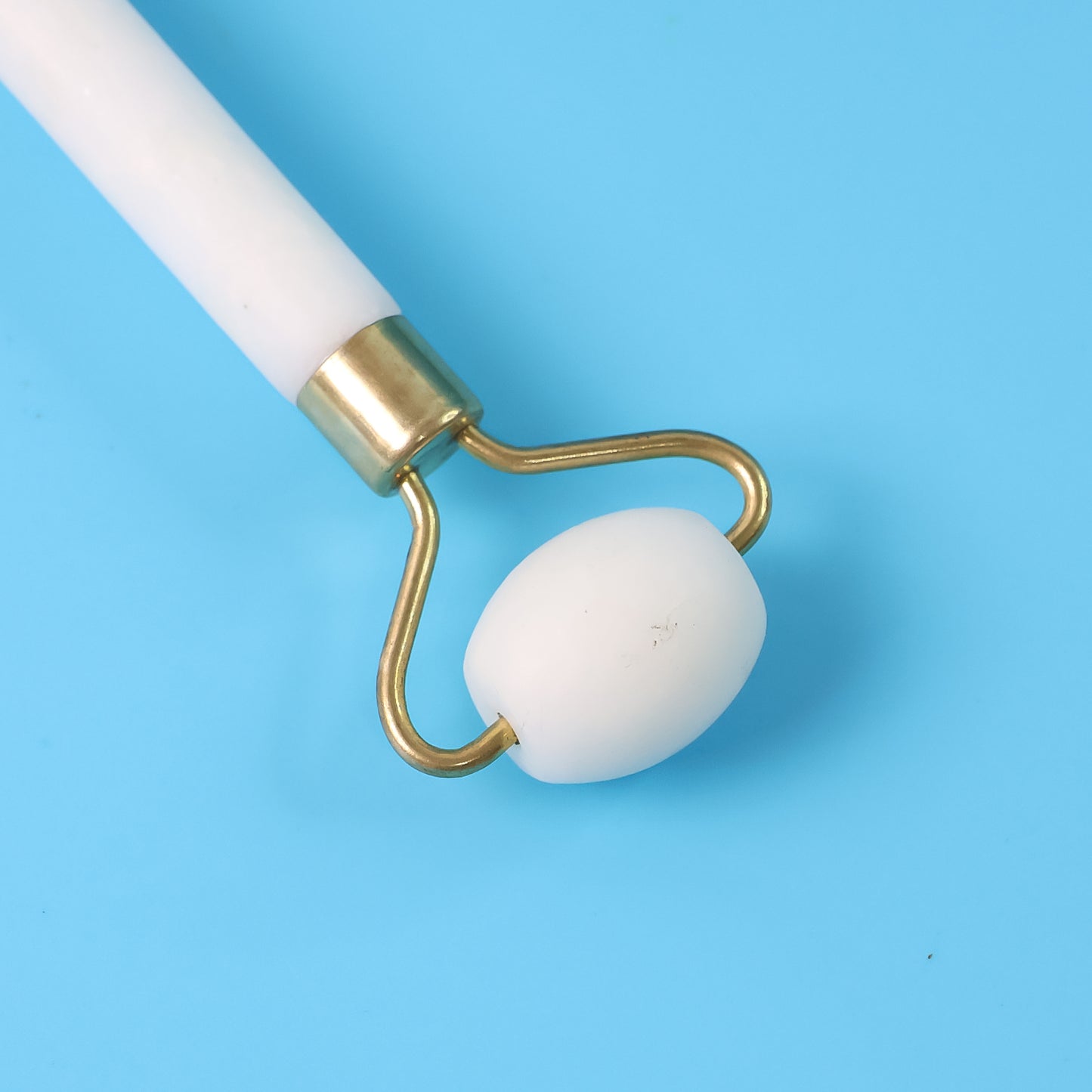 Wukusy dual-ended face massage roller with textured and smooth surfaces for facial skin relaxation and rejuvenation.