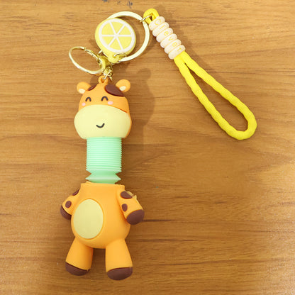 Cute giraffe cartoon keychain from Wukusy featuring a colorful, smiling giraffe character with a small metal keyring.