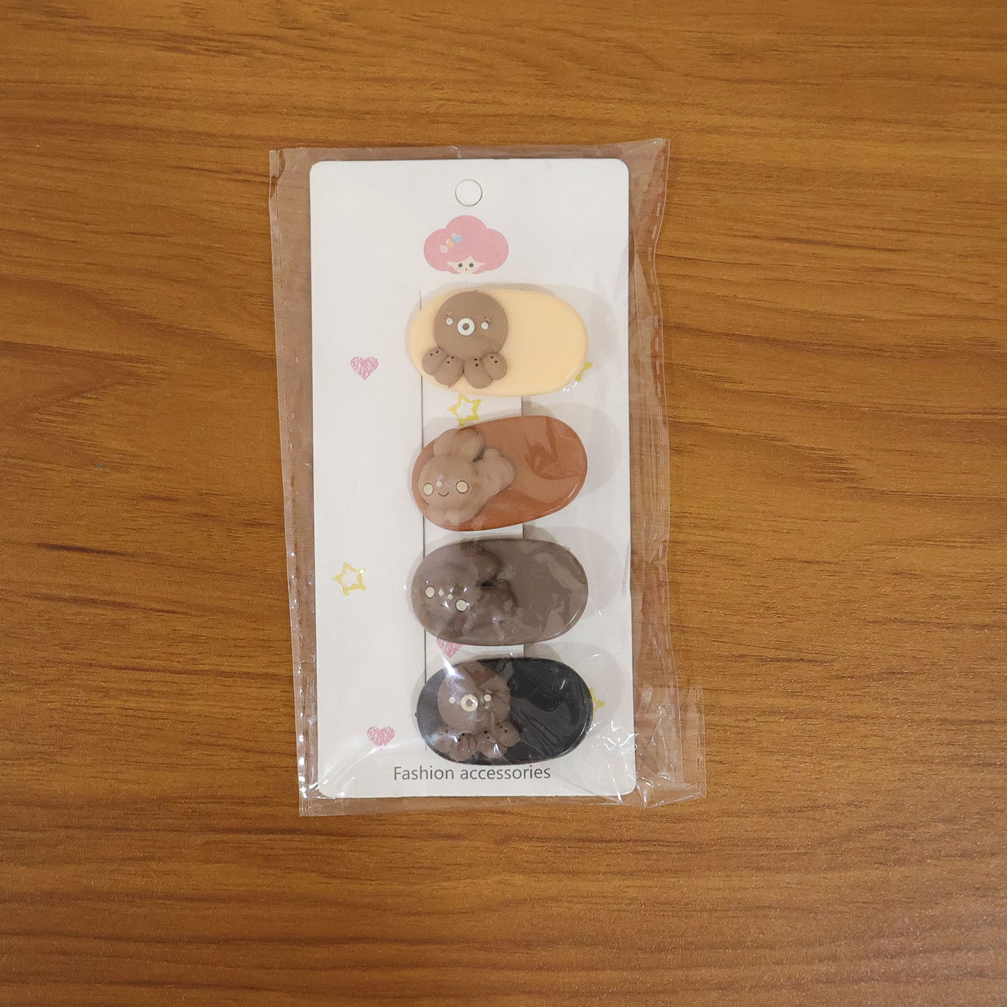 Set of four cute cartoon bear design hair clips by Wukusy, featuring playful bear faces and colorful styles for kids.