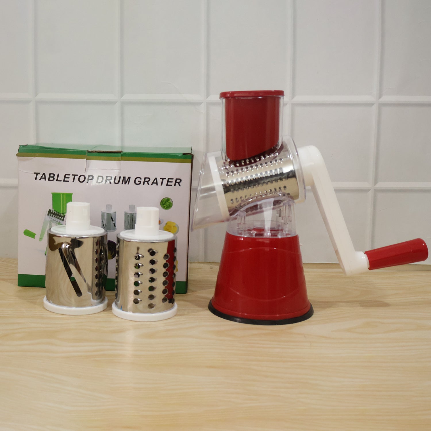 Wukusy manual rotary drum grater and slicer set with three stainless steel drums for vegetable shredding and slicing.