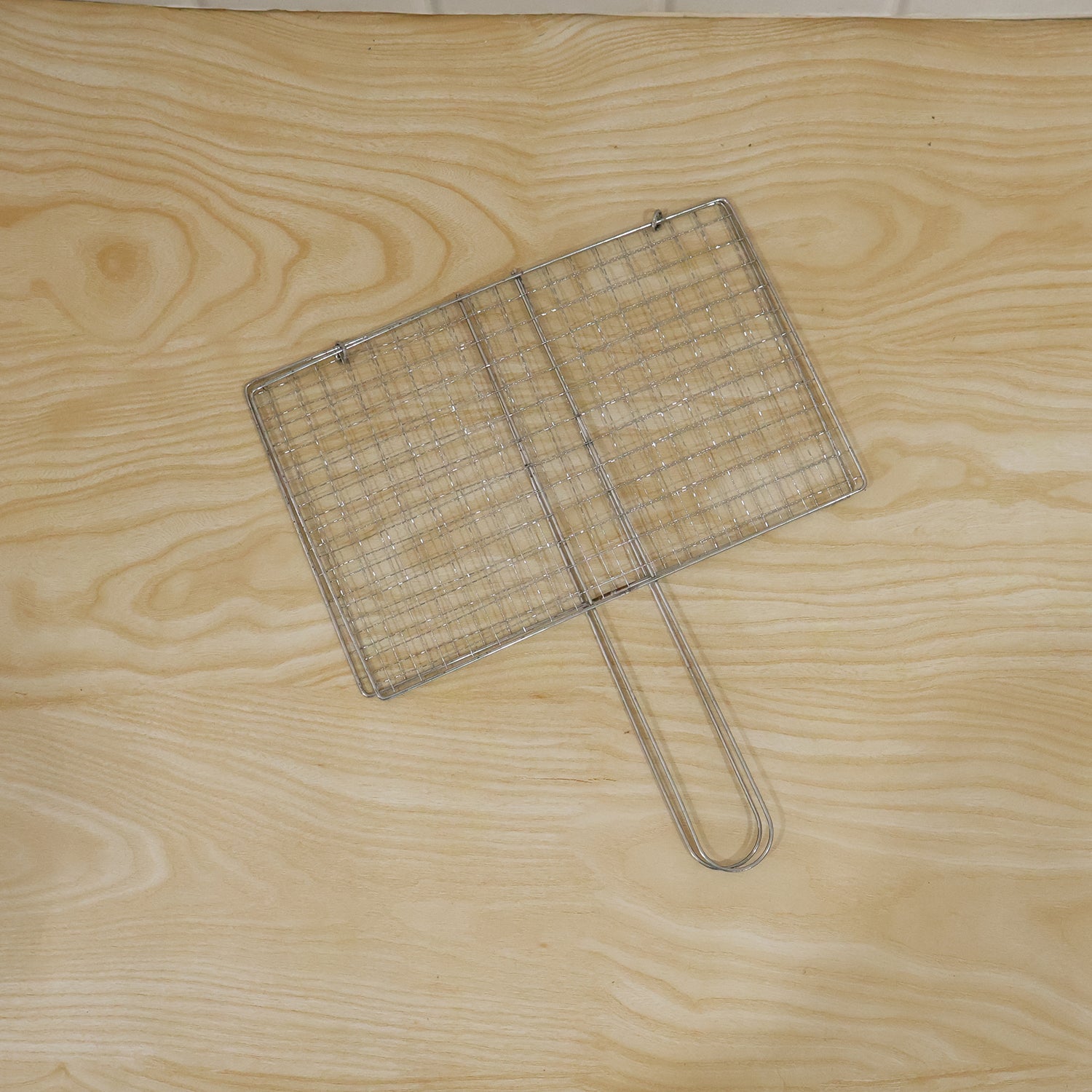 Foldable stainless steel BBQ grill wire mesh with handle by Wukusy, ideal for outdoor grilling and easy to fold and clean.