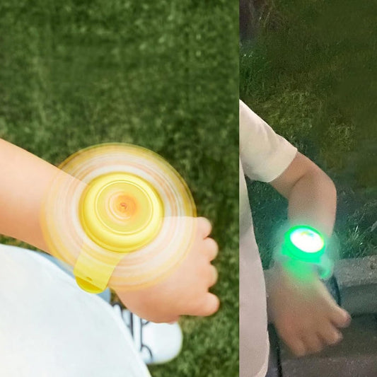 Colorful spinning LED light bracelet for kids by Wukusy, featuring cartoon character design on a flexible wrist band.