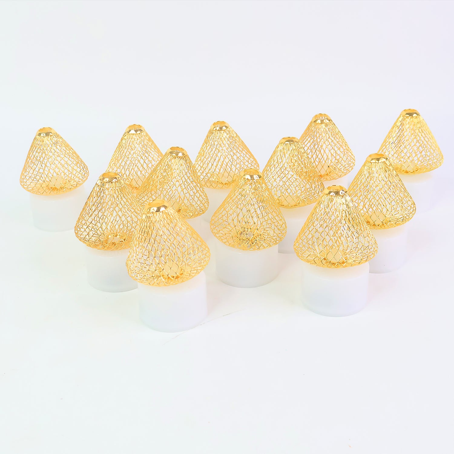 Set of 12 decorative LED flameless candle lights with golden net covers for home decor by Wukusy, shown on a table.