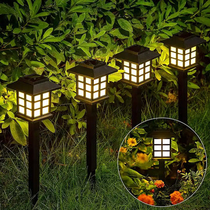 Wukusy 1493 Big Solar Outdoor Lights 6-pack waterproof LED pathway lights illuminating garden walkways and driveways.