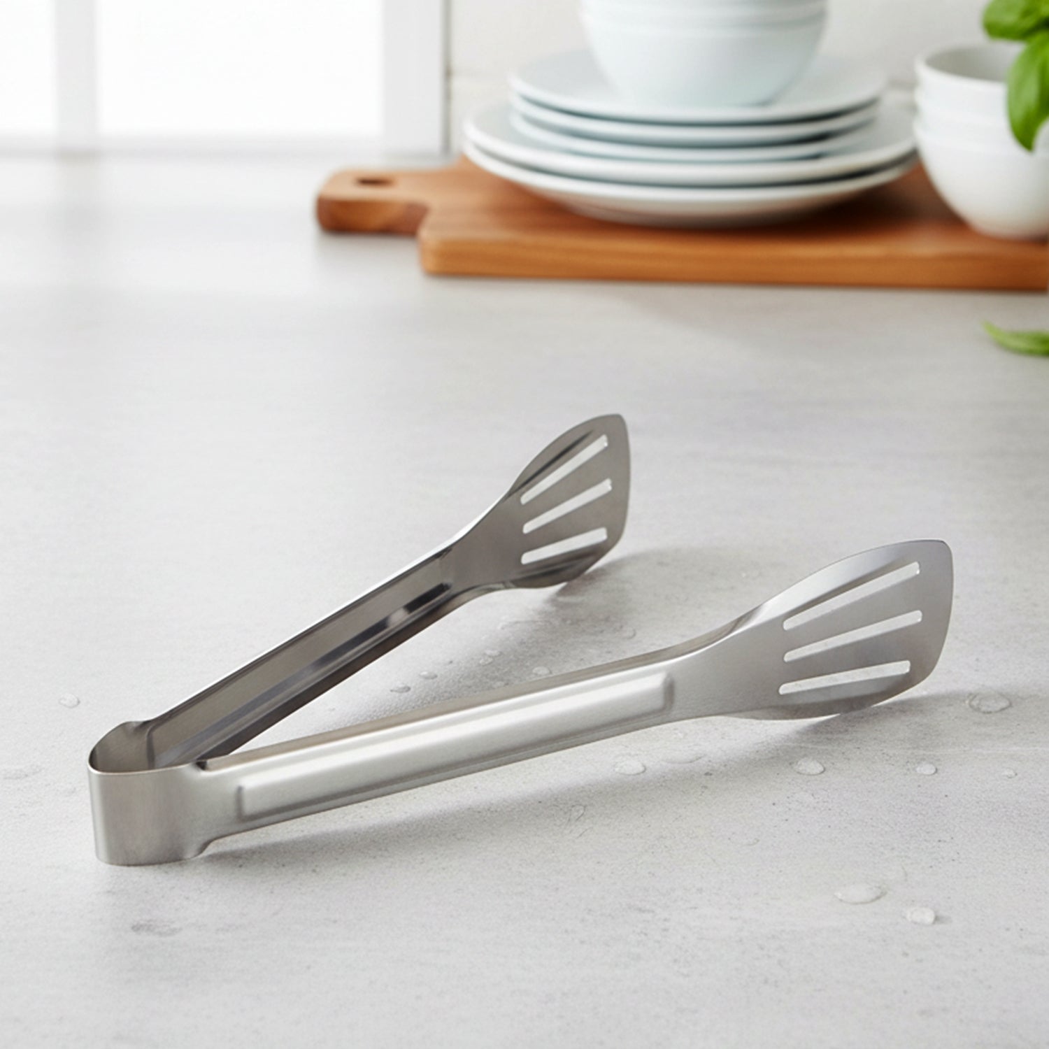 Stainless steel kitchen serving tongs by Wukusy with a sleek, durable design for food serving and handling.