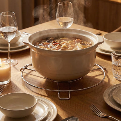 Stainless steel round hot pot stand by Wukusy, suitable for home and kitchen use, supporting hot pots securely.