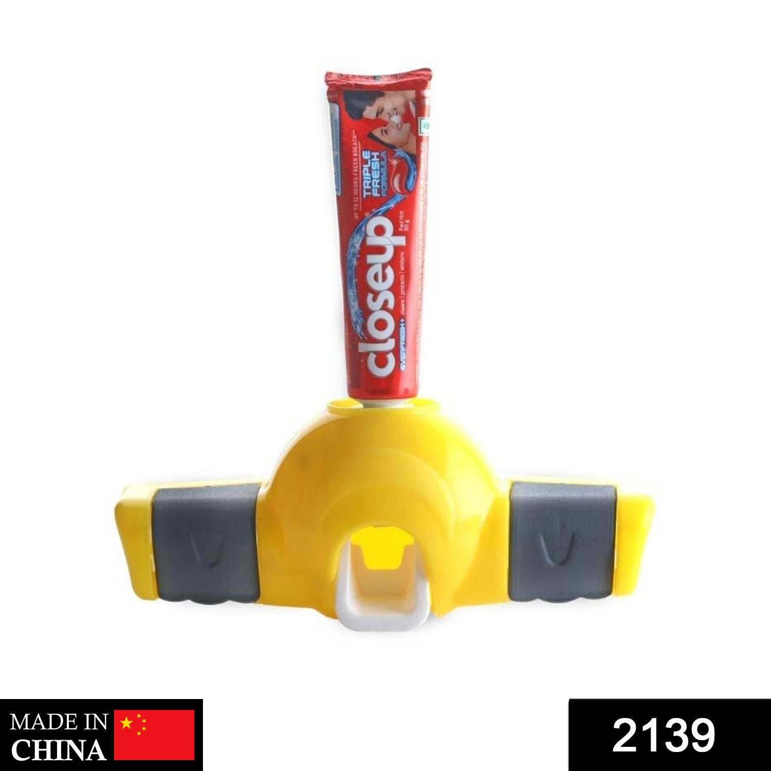 Wukusy 2139 Automatic Push Toothpaste Squeezer Dispenser mounted on bathroom wall, for easy toothpaste application and storage.
