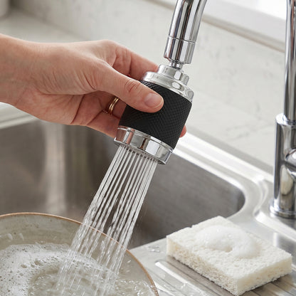 Wukusy kitchen water faucet sprayer with 360° rotatable tap extender nozzle installed on a sink for flexible water flow.