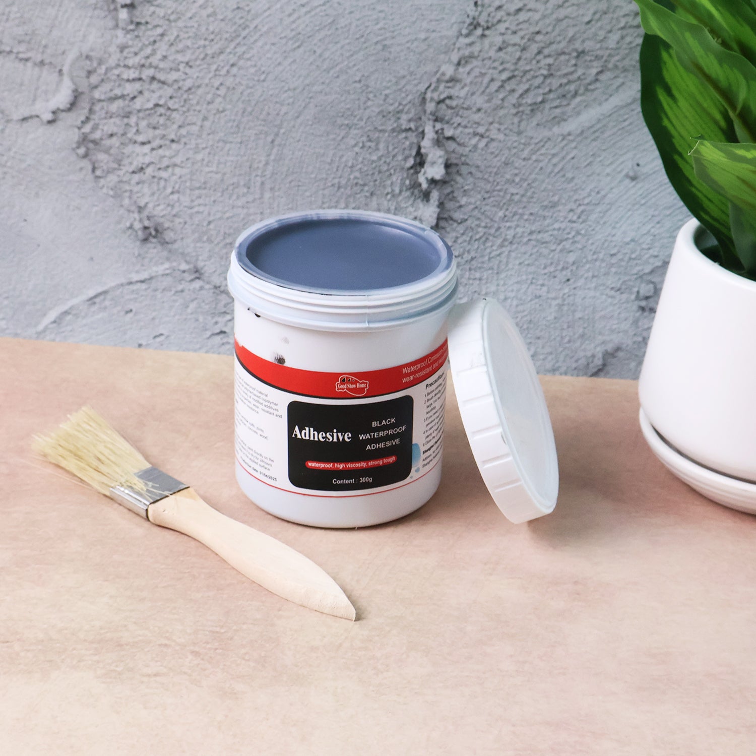 Wukusy black waterproof adhesive paste in 300g set, suitable for home improvement projects, shown in the image.