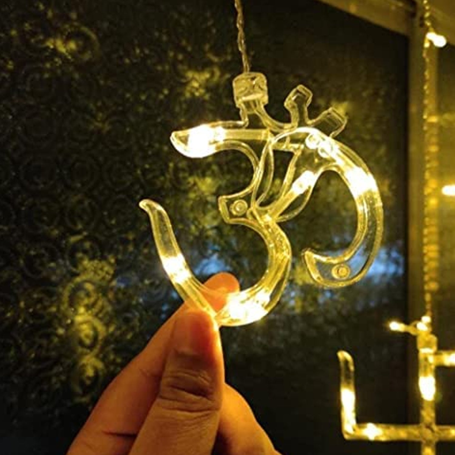 Wukusy 8320 Swastik Om decorative string lights with 12 hanging props, 138 LED Diwali home decor lights for bedroom or balcony.