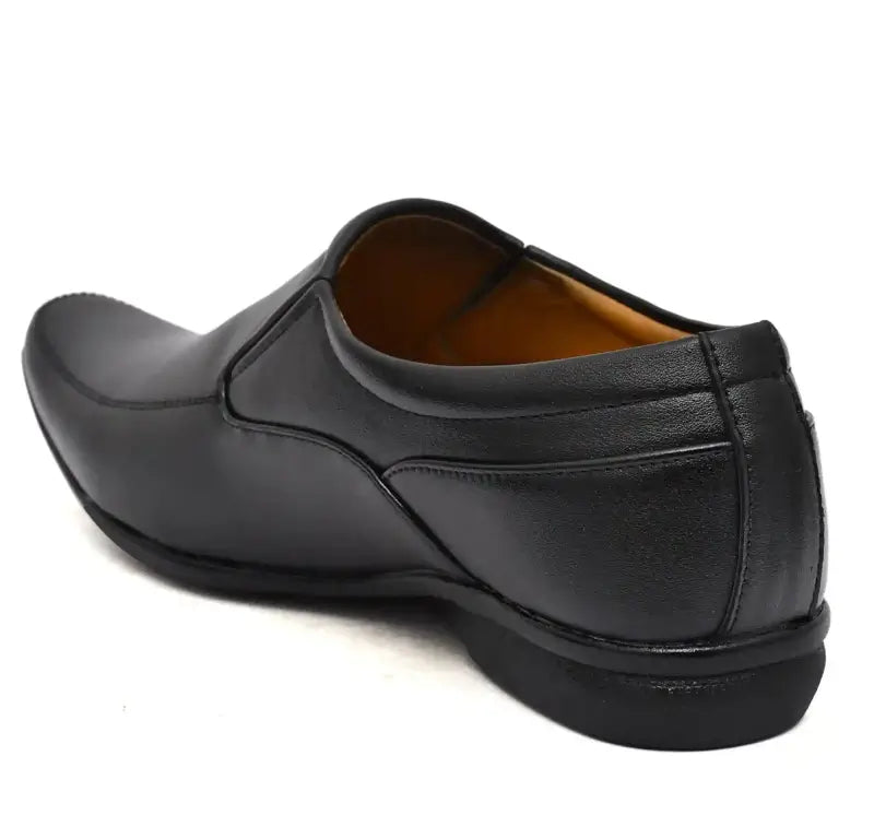 Black men's formal moccasin shoes by Ekom, suitable for office wear, featuring a sleek design and comfortable fit.