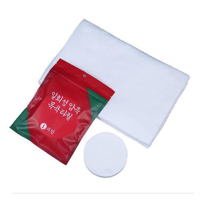 Wukusy compressed cotton towel for travel and outdoor use, showing a portable disposable tissue coin for camping, hiking, and sports.