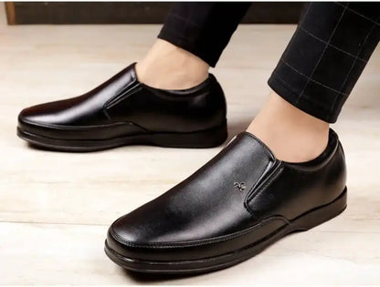 Black men's formal moccasin shoes from Ekom, designed for office wear, featuring a sleek, stylish look suitable for boys and men.
