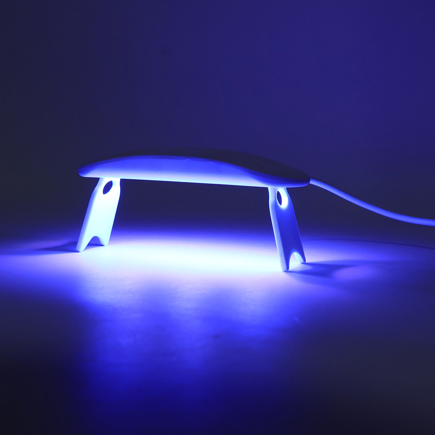 Wukusy mini portable UV LED nail lamp for gel nail polish curing, compact design, shown on a white background