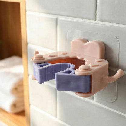 Set of four Wukusy wall-mounted broom and mop holder clips attached to a wall for organizing cleaning tools.