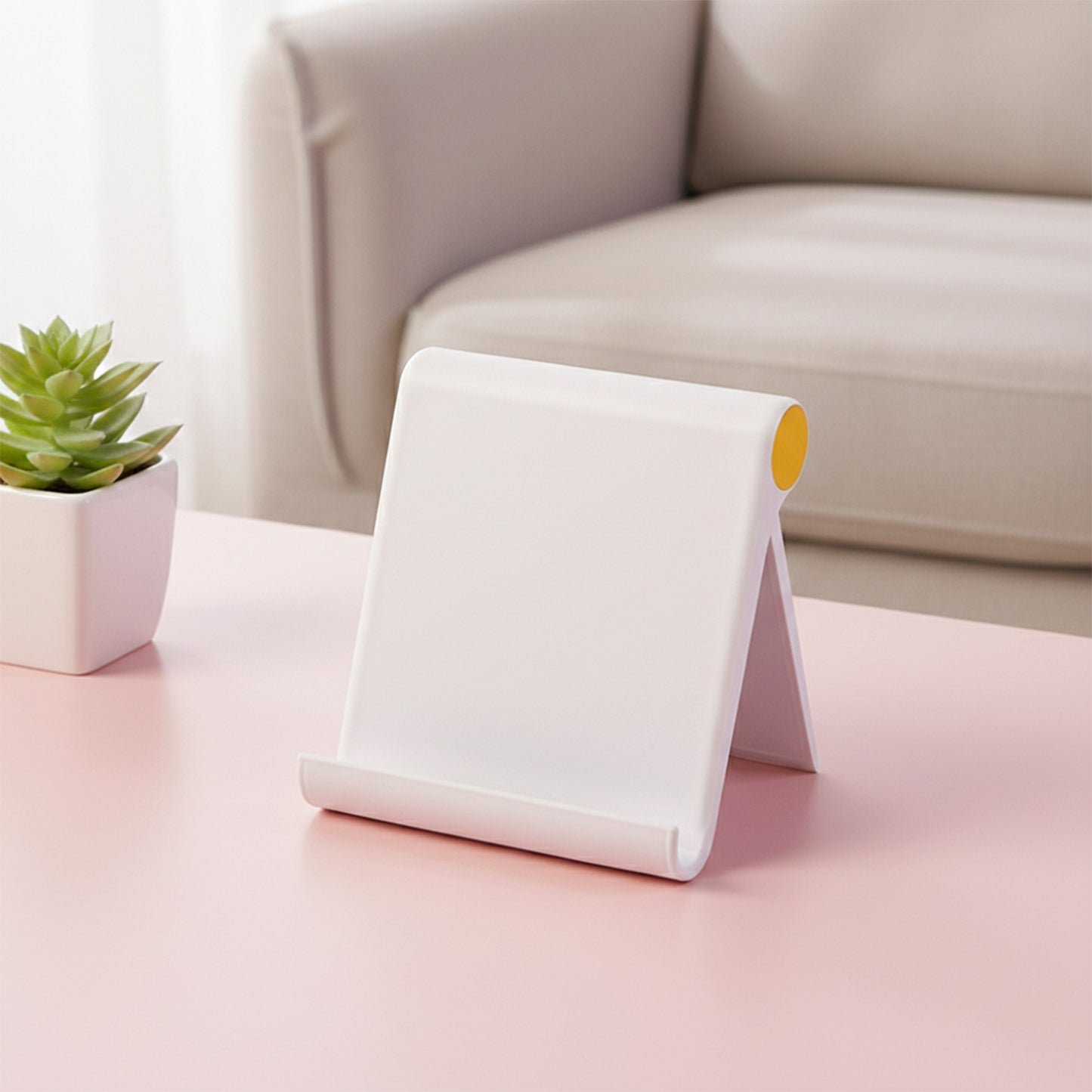 White plastic foldable desktop mobile stand by Wukusy, adjustable holder for smartphones on a clean workspace.