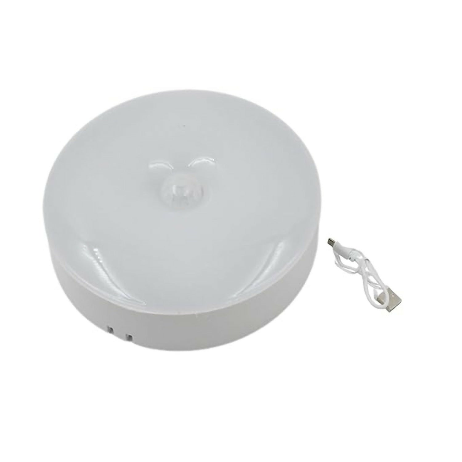 Wukusy rechargeable motion sensor LED night light with USB charging, illuminated with soft light in a dark room setting.