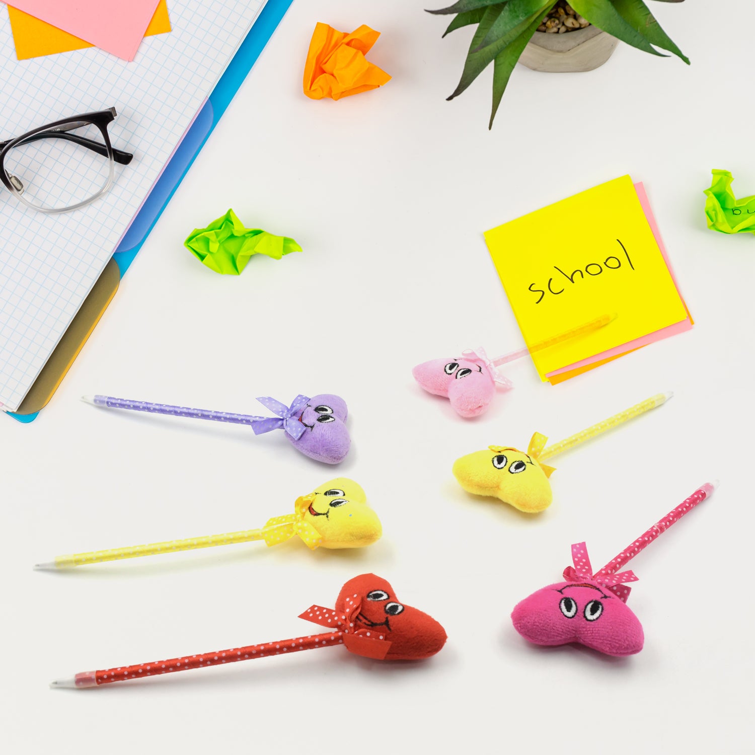 Set of 12 Wukusy cartoon heart-shaped pens with attached rattles, smooth writing, colorful designs, perfect for kids and events.