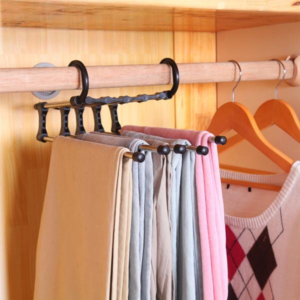 Wukusy 4660 adjustable trouser pants hanger organizer with multiple clips for neat, space-saving clothing storage.