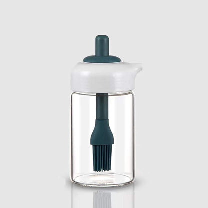 Wukusy 2-in-1 glass oil dispenser jar with brush, featuring a clear bottle and integrated brush for cooking and seasoning.