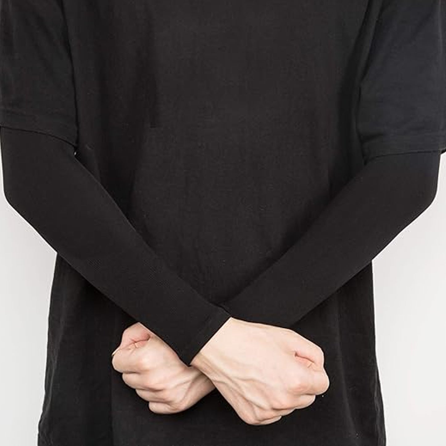 Pair of Wukusy stretchable elbow support compression sleeves showing flexible fabric and snug fit on the elbows.