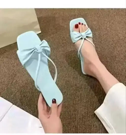 Ekom women's slip-on flip-flops with stylish design, featuring comfortable straps and casual footwear for everyday wear.
