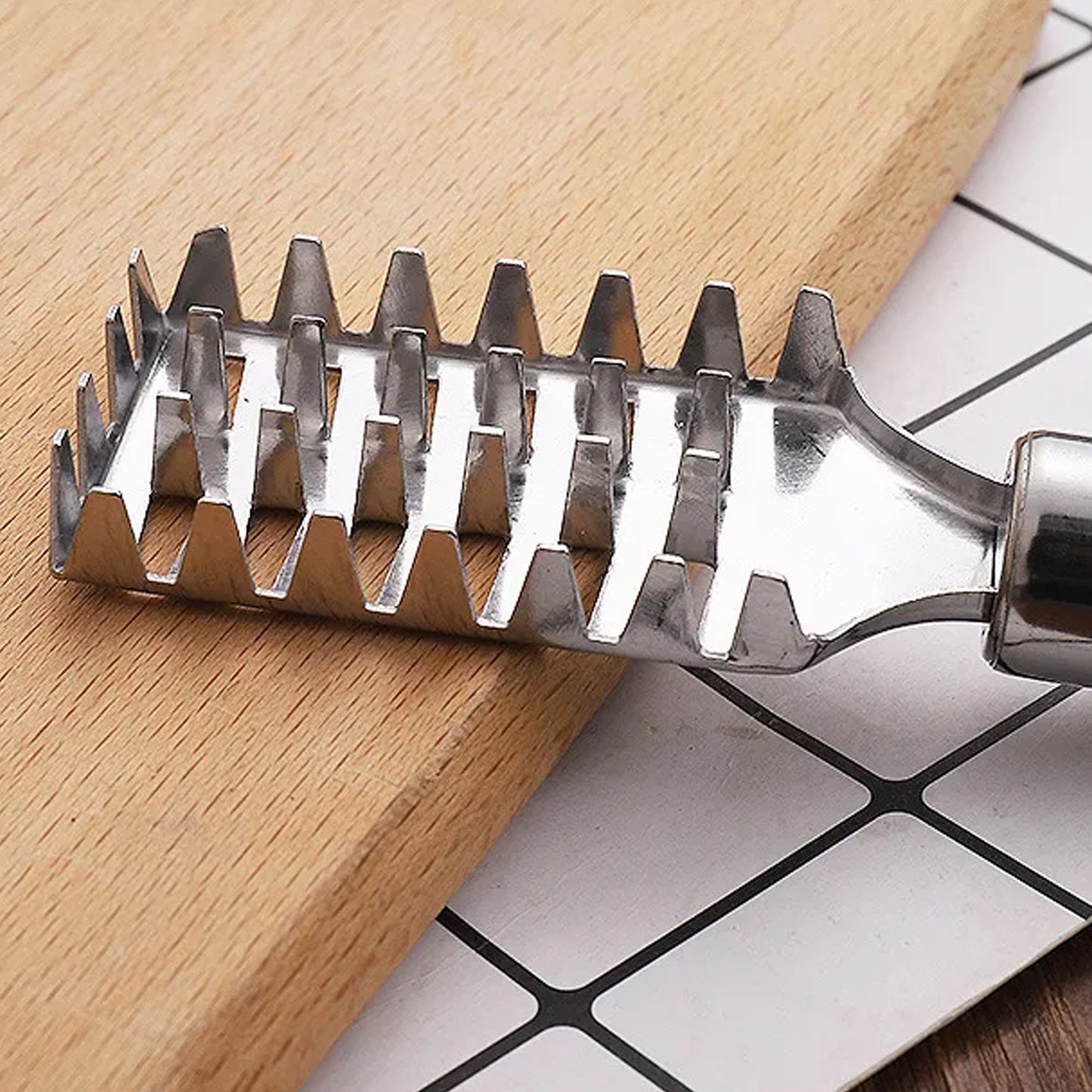 Wukusy stainless steel fish scale remover scraper with sawtooth edge, kitchen tool for easily cleaning and removing fish scales.