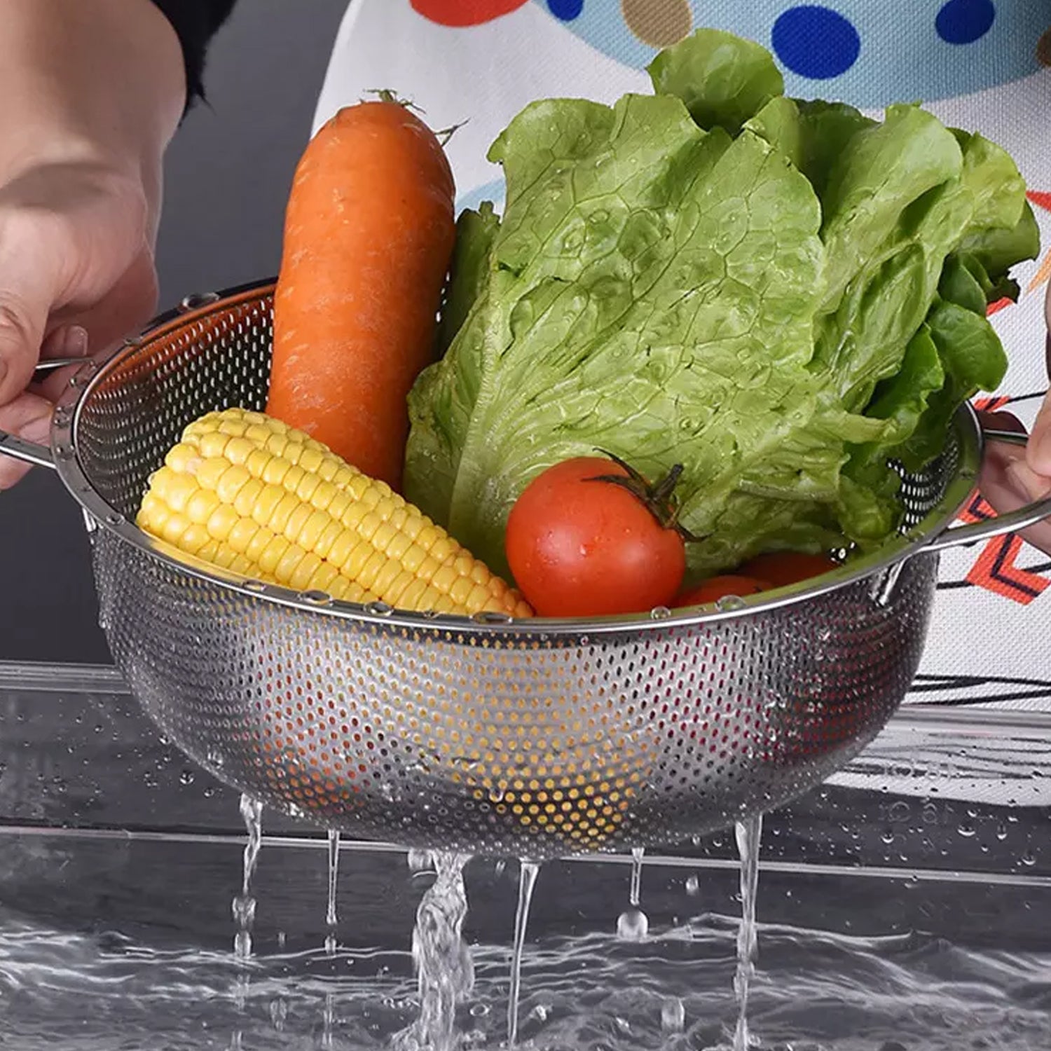 Wukusy stainless steel collapsible rice and vegetable washing bowl with strainer, kitchen tool for rinsing and draining food.