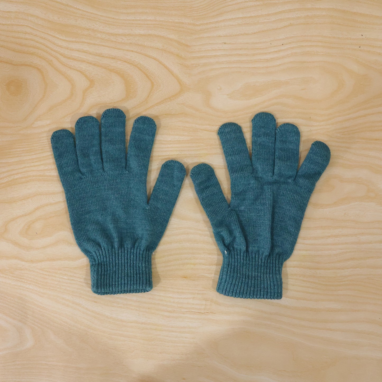 Pair of Wukusy warm winter knitted gloves for men and women, soft, stretchable, and cozy for cold weather.