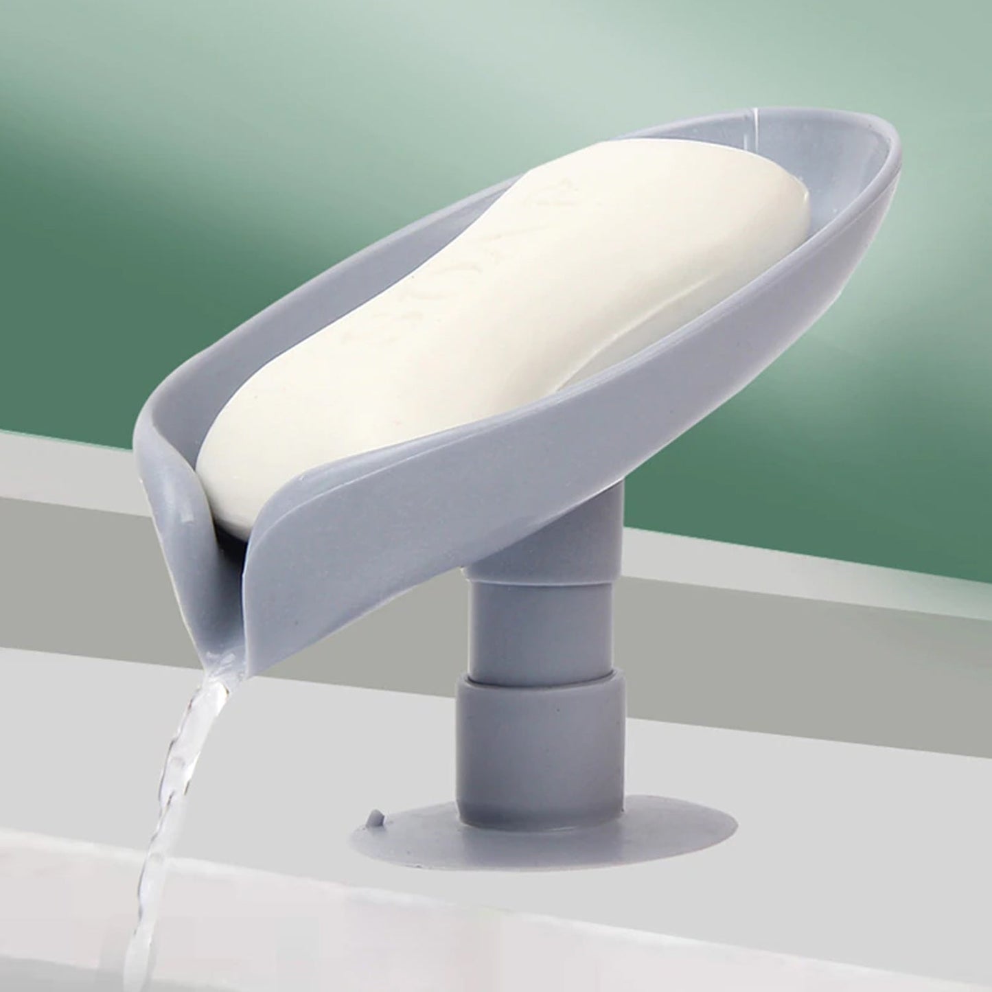 Wukusy self-draining soap holder with leaf-shaped design, suitable for bathroom or kitchen soap dishes and trays.