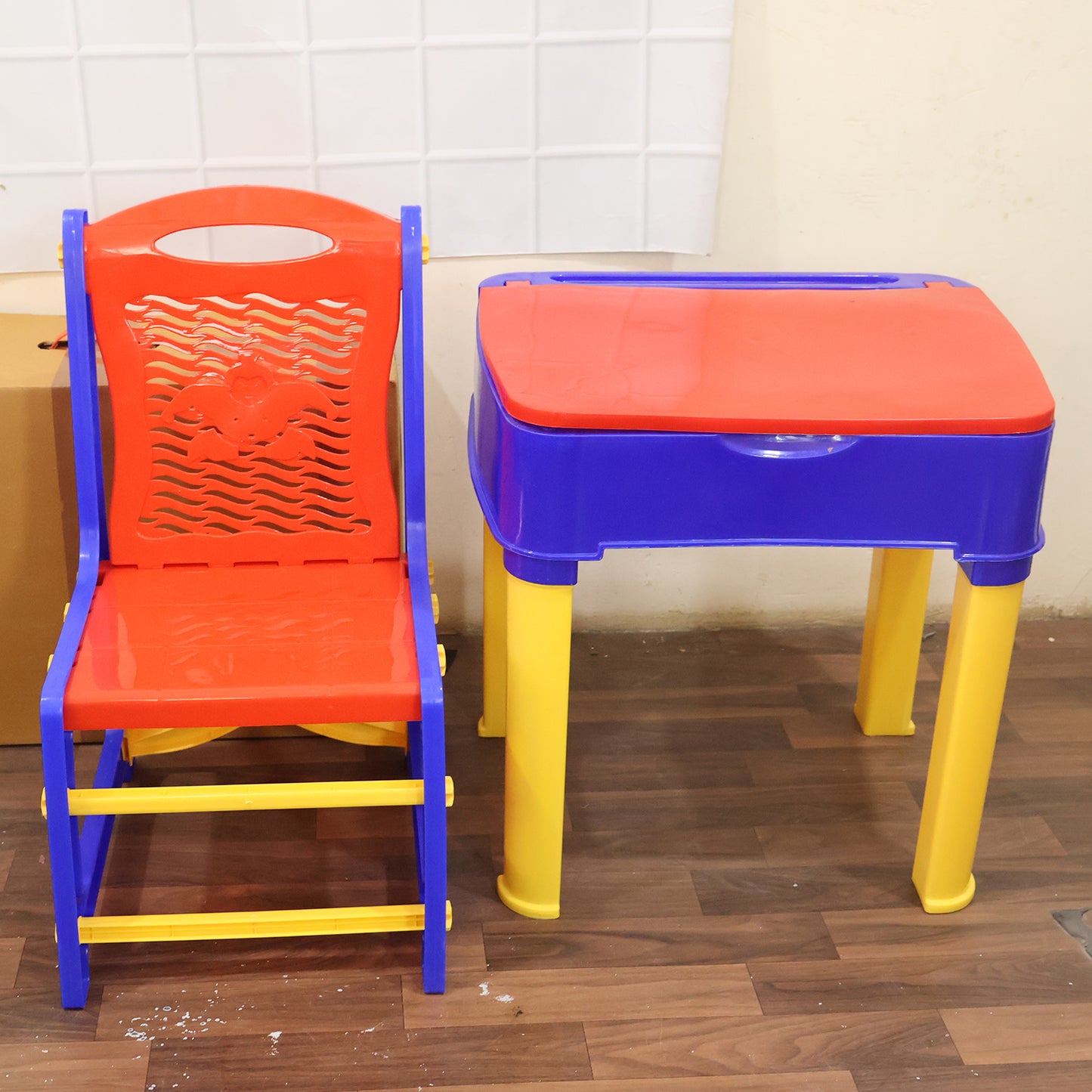 Wukusy 2-in-1 plastic kids study table and chair set with a learning board, featuring colorful design and sturdy construction.