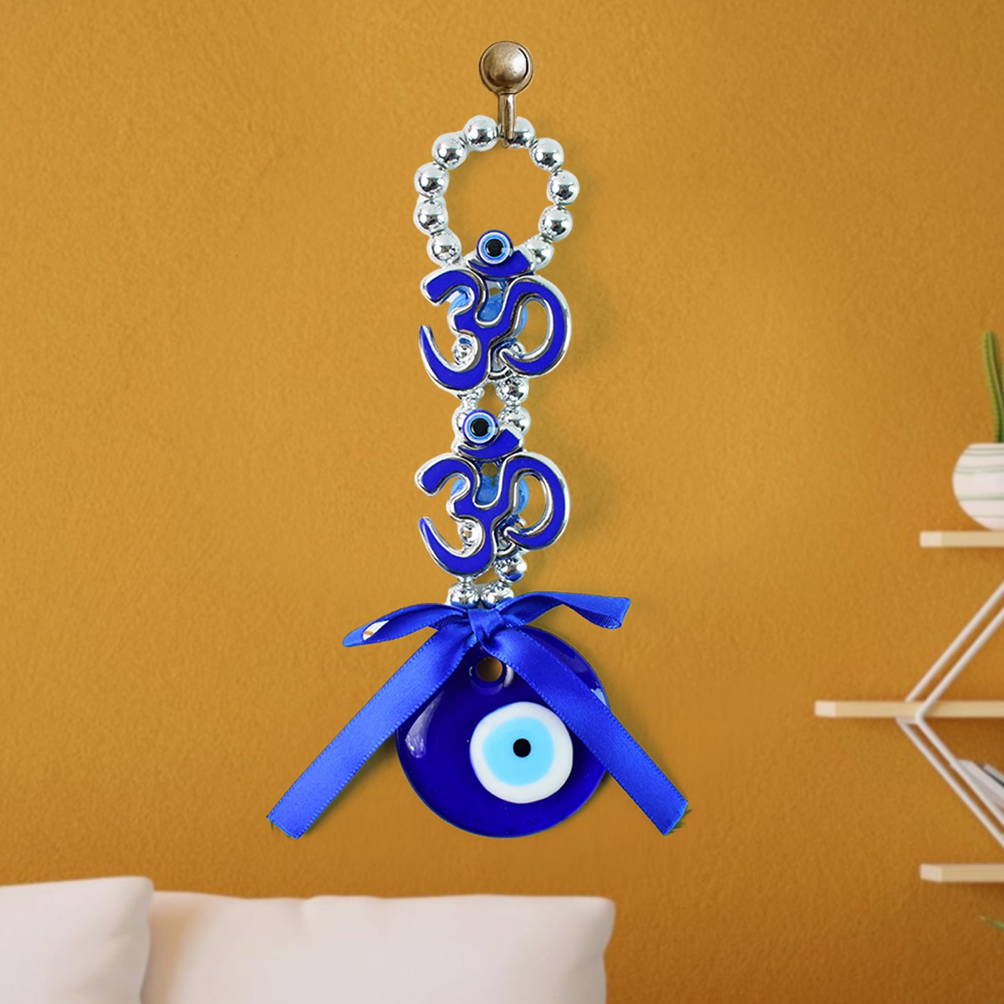 Decorative Wukusy double Om symbol evil eye hanging ornament with intricate design and vibrant colors on a white background.
