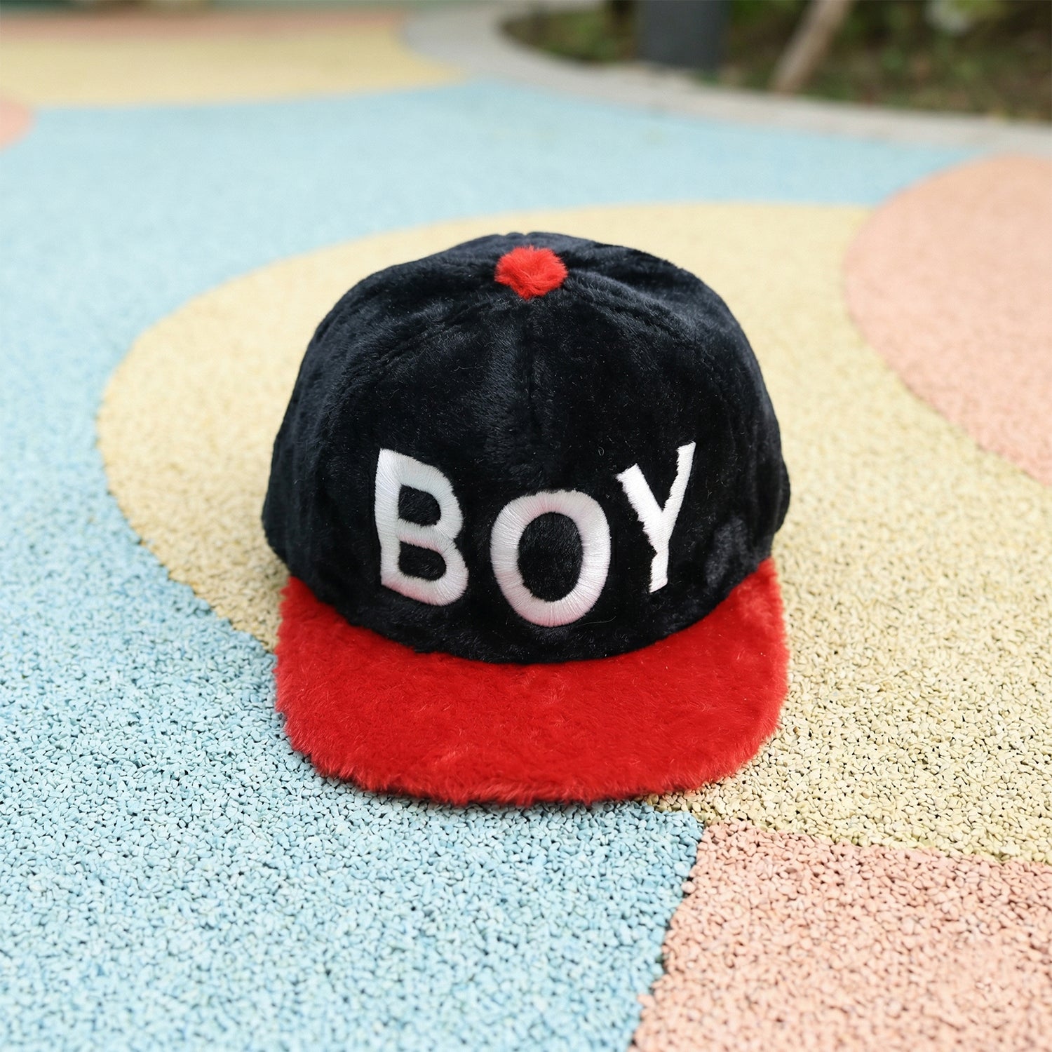 Wukusy boys' printed fashion cap featuring colorful patterns, stylish design, and a comfortable fit for trendy kids.