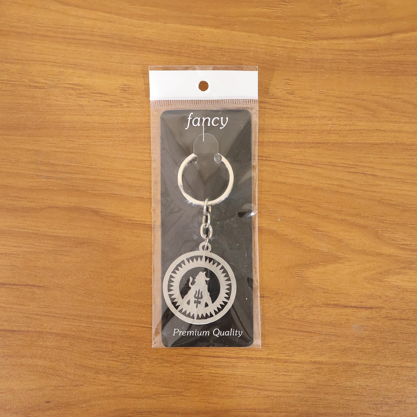 Premium metal round Mahakal keychain by Wukusy featuring intricate Mahakal design on a sleek round metal surface.